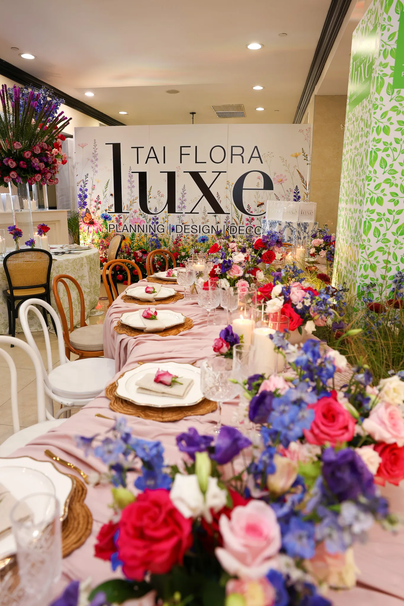 Colourful floral arrangements and an elegant wedding table by Tai Flora Luxe