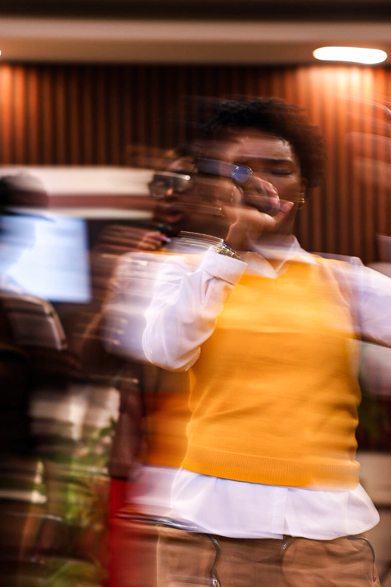 Performer in yellow captured in motion