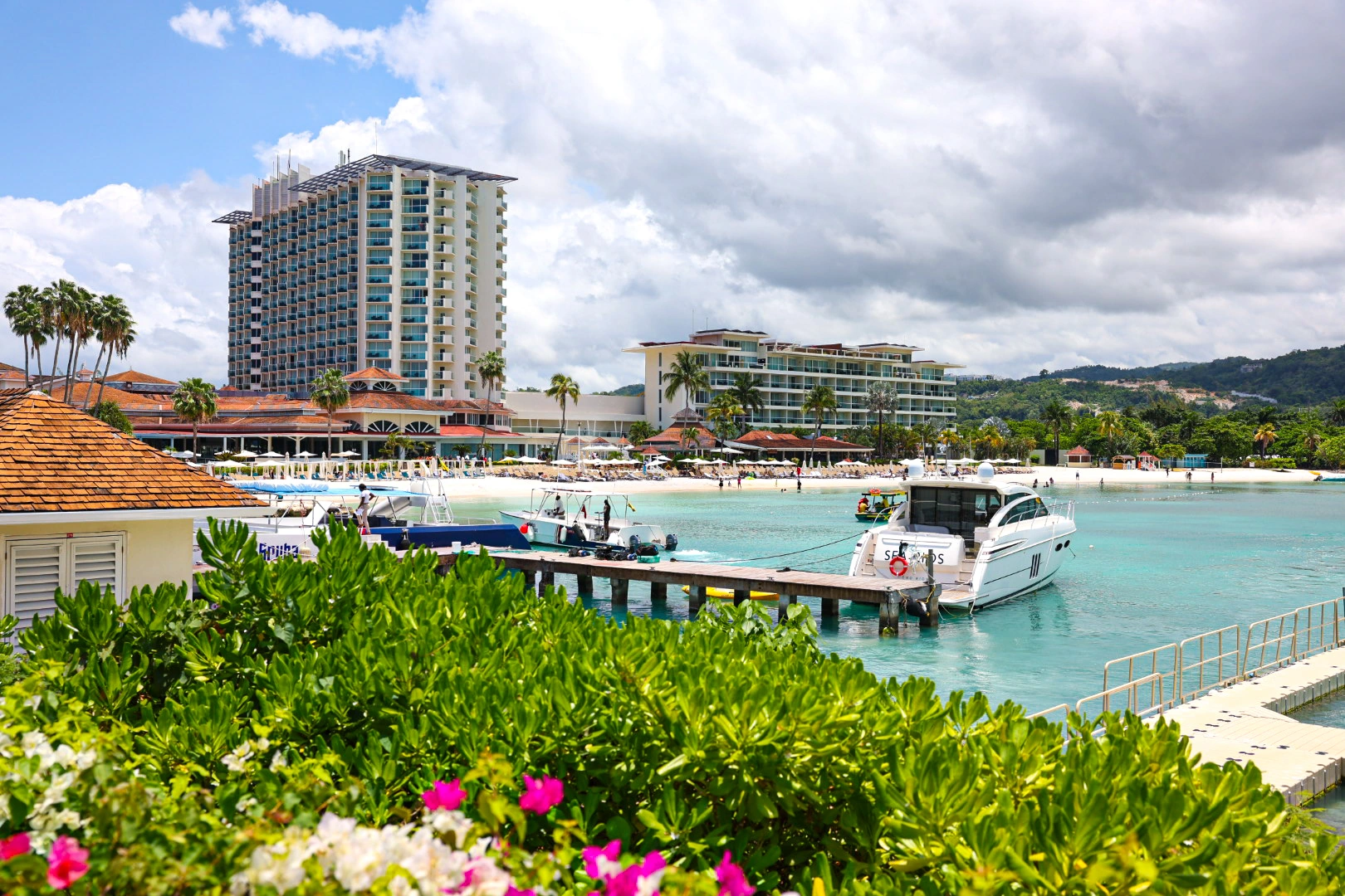 Jamaican coastal resort and boats on turquoise water